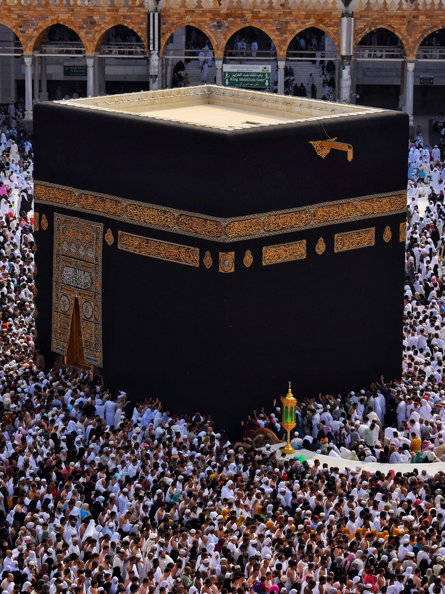The Kaaba at the Grand Mosque in Makkah, surrounded by pilgrims